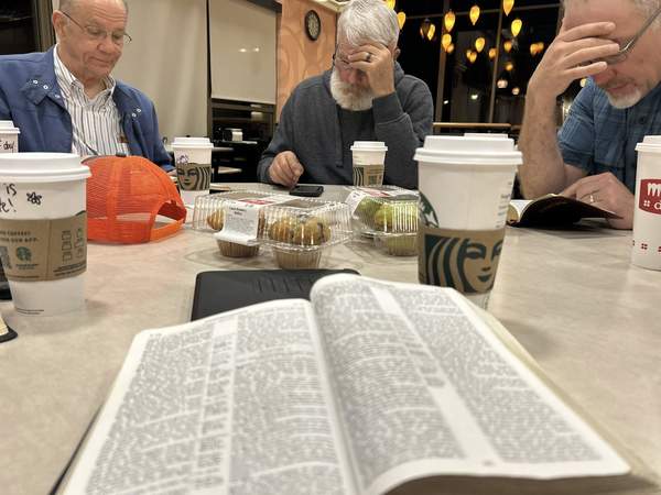 Men gathering for Bible study and prayer